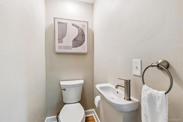 1895 S Emerson St, Denver, CO 80210 - half bath featuring toilet and baseboards