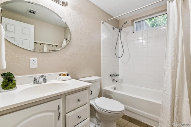1895 S Emerson St, Denver, CO 80210 - full bath featuring a textured wall, shower / tub combo with curtain, vanity, and tile patterned floors