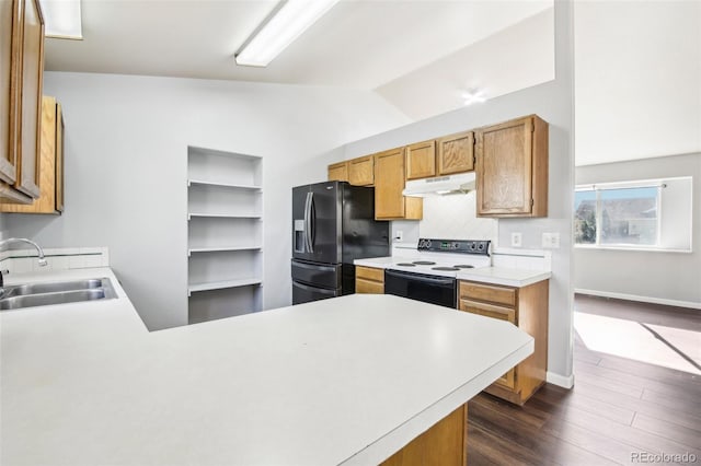 kitchen featuring sink, black fridge, white electric stove, kitchen peninsula, and vaulted ceiling