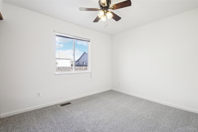 carpeted empty room featuring ceiling fan