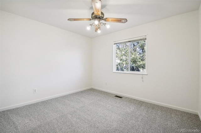 carpeted empty room featuring ceiling fan