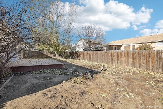 view of yard featuring a wooden deck