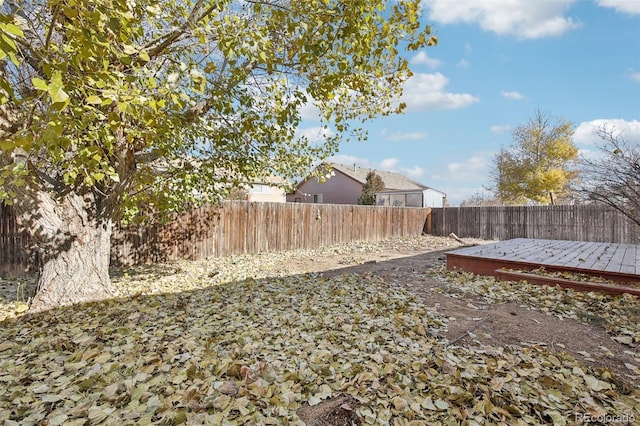 view of yard featuring a wooden deck