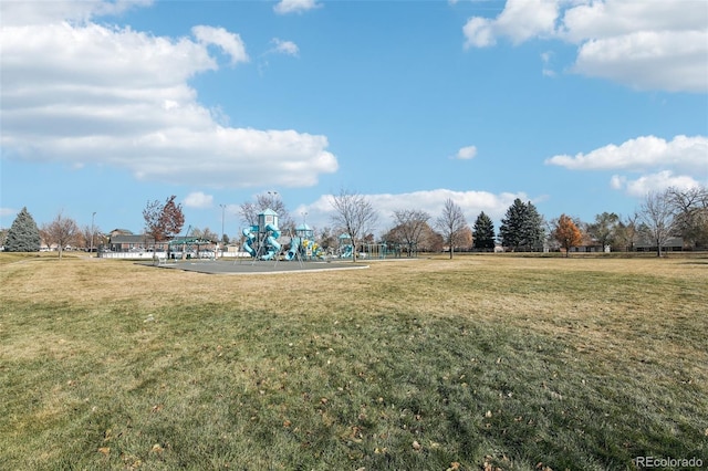 view of community with a yard and a playground