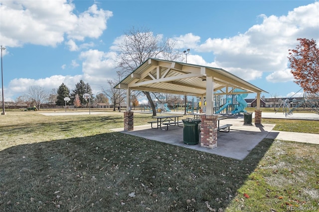 view of property's community featuring a playground and a lawn