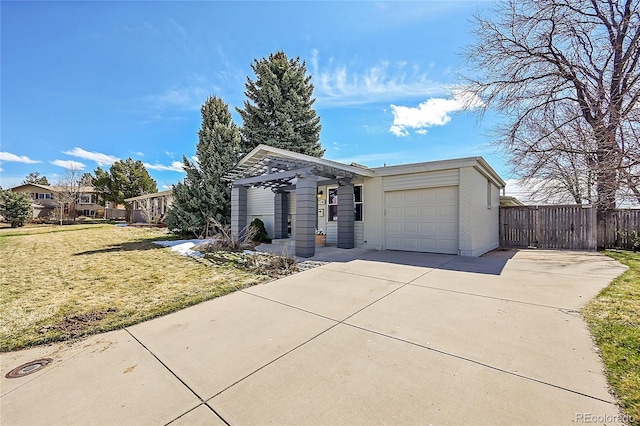 ranch-style house with a garage, brick siding, fence, driveway, and a front yard