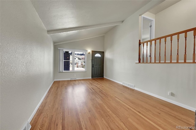 7240 S Cherry Dr, Centennial, CO 80122 - entryway featuring visible vents, lofted ceiling with beams, baseboards, and wood finished floors