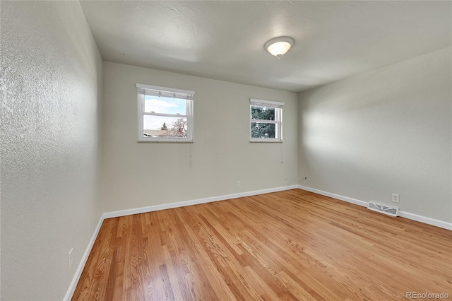 7240 S Cherry Dr, Centennial, CO 80122 - spare room featuring light wood finished floors, visible vents, and baseboards