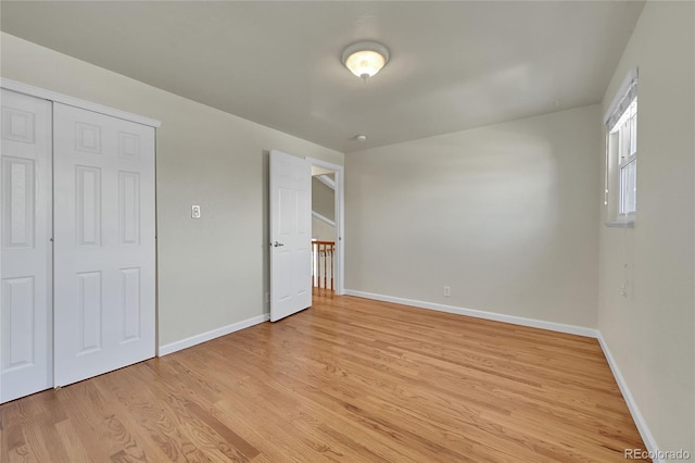 7240 S Cherry Dr, Centennial, CO 80122 - unfurnished bedroom featuring baseboards, a closet, and light wood-style floors