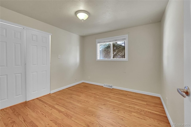 7240 S Cherry Dr, Centennial, CO 80122 - unfurnished bedroom featuring light wood-type flooring, visible vents, and baseboards