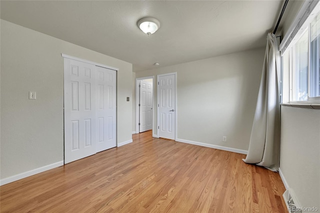 7240 S Cherry Dr, Centennial, CO 80122 - unfurnished bedroom featuring light wood-style floors, baseboards, and visible vents