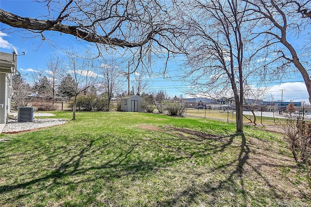 7240 S Cherry Dr, Centennial, CO 80122 - view of yard with an outbuilding, central AC, a storage shed, and fence