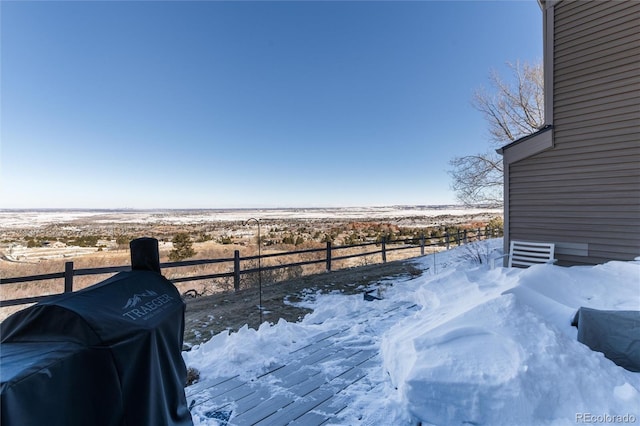 view of yard layered in snow