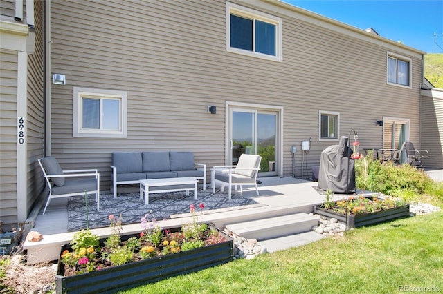 6980 Fargo Trl, Littleton, CO 80125 - back of house with an outdoor hangout area, a deck, and a lawn
