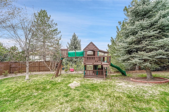 view of play area featuring a lawn and fence