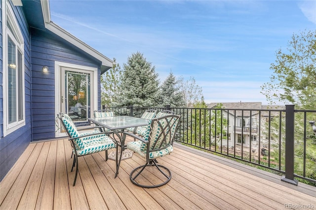 wooden deck with outdoor dining space