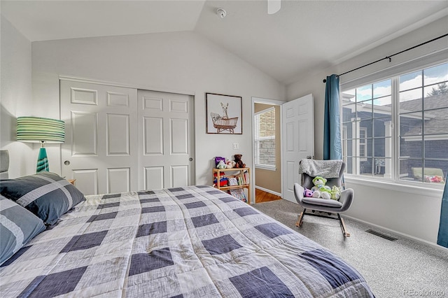 bedroom with visible vents, baseboards, lofted ceiling, and a closet