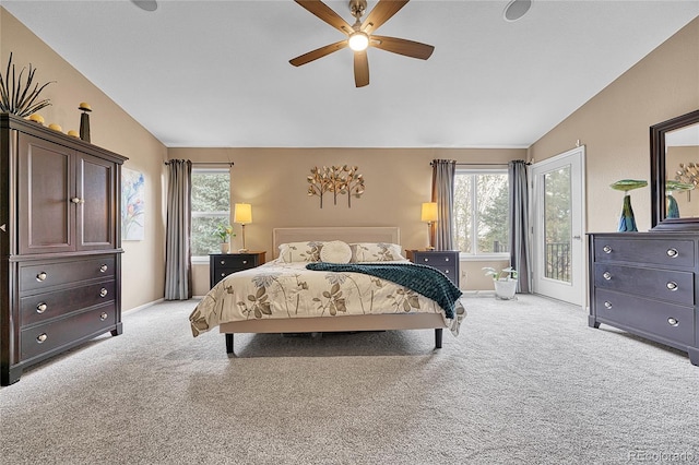 bedroom with ceiling fan, light colored carpet, multiple windows, and lofted ceiling