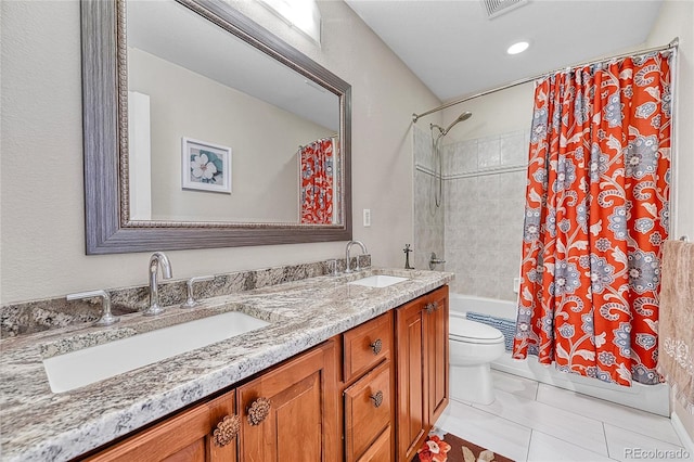 full bathroom with a sink, tile patterned floors, toilet, and shower / tub combo