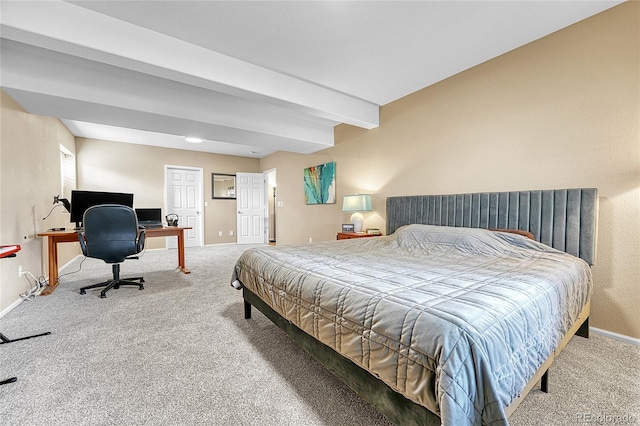 carpeted bedroom featuring baseboards and beam ceiling