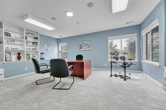 carpeted home office with baseboards and visible vents
