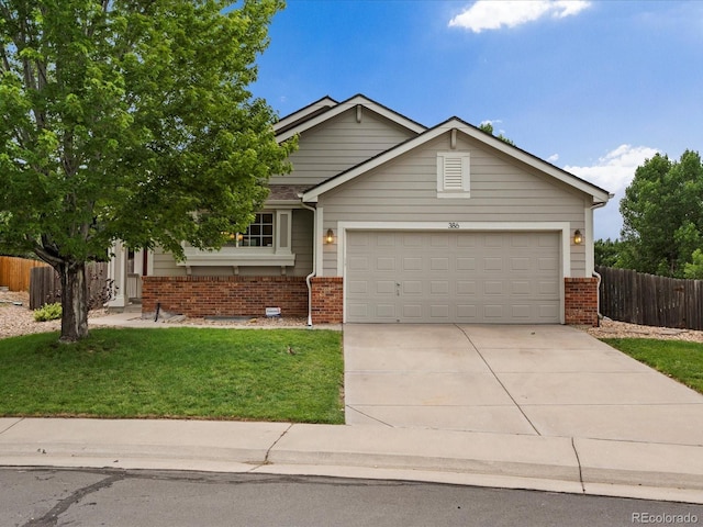 386 Monte Vista St, Brighton, CO 80601 - view of front of home with brick siding, concrete driveway, and an attached garage