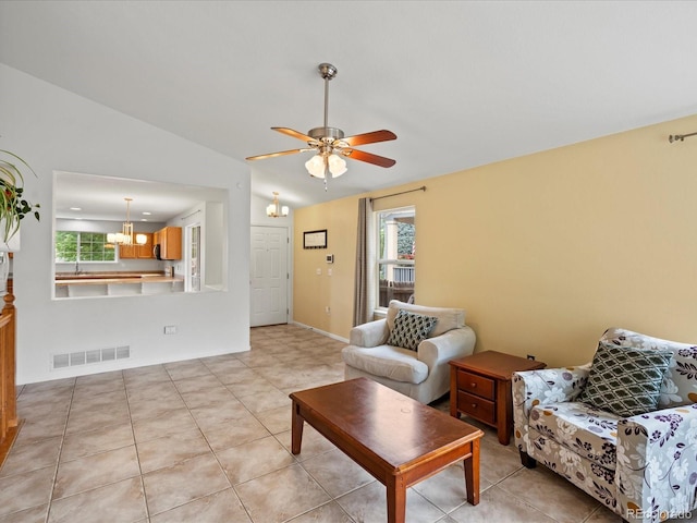 386 Monte Vista St, Brighton, CO 80601 - living area with a chandelier, lofted ceiling, ceiling fan, and light tile patterned flooring