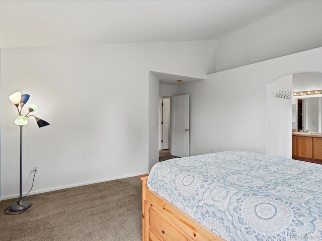 386 Monte Vista St, Brighton, CO 80601 - bedroom featuring vaulted ceiling, carpet, and arched walkways