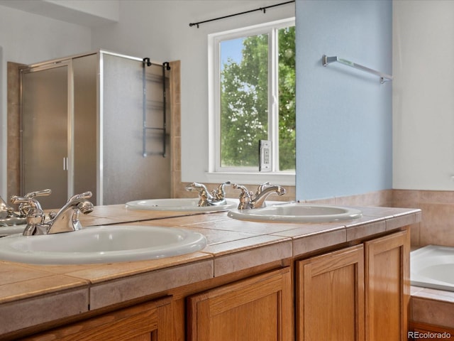 386 Monte Vista St, Brighton, CO 80601 - bathroom featuring double vanity, a stall shower, and a garden tub
