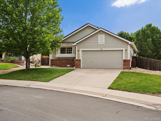386 Monte Vista St, Brighton, CO 80601 - view of front of home featuring brick siding, a garage, and driveway