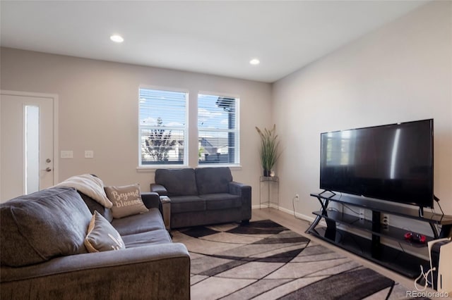 living area with recessed lighting and baseboards