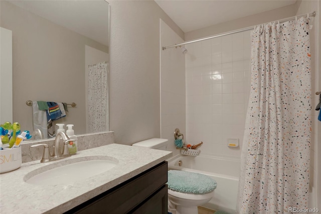 bathroom with shower / tub combo, vanity, and toilet