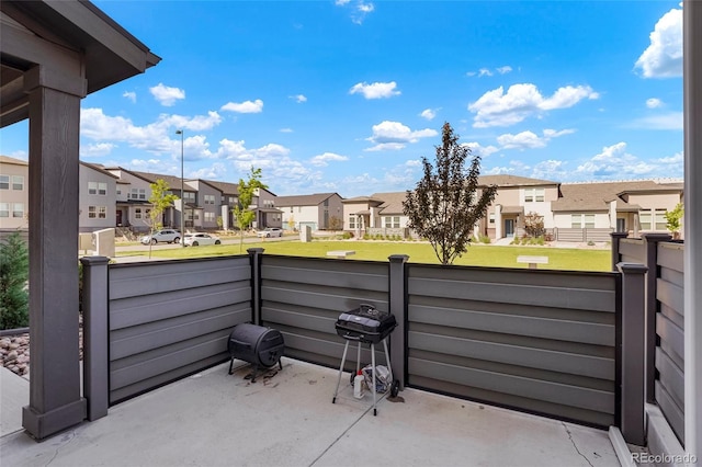 view of patio featuring a residential view, a balcony, and area for grilling