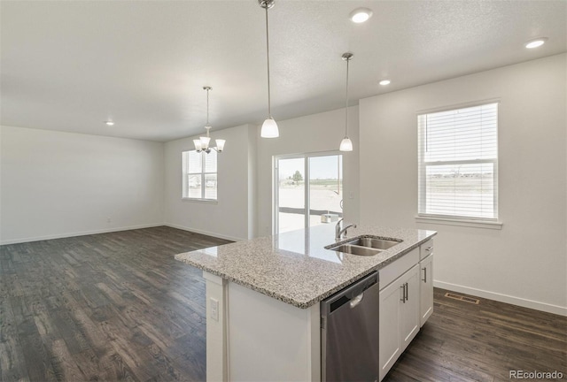 15963 Syracuse St, Thornton, CO 80602 - kitchen featuring dishwasher, dark wood-style flooring, white cabinetry, light stone counters, and a kitchen island with sink