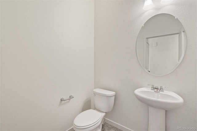 bathroom with toilet and sink