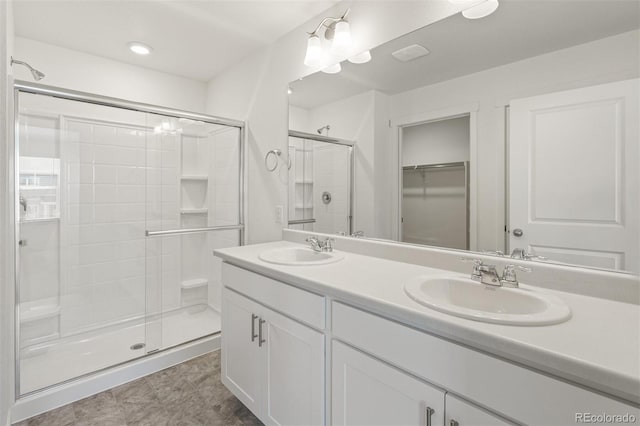 bathroom with vanity and an enclosed shower