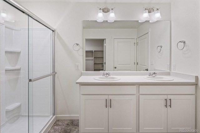 15963 Syracuse St, Thornton, CO 80602 - full bath featuring a shower stall, double vanity, and a closet