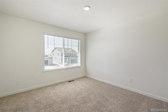 view of carpeted spare room