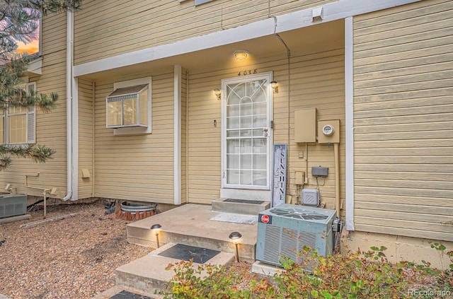 exterior entry at dusk with central AC unit