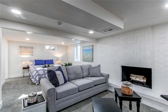 carpeted living room with recessed lighting, a fireplace, visible vents, and baseboards