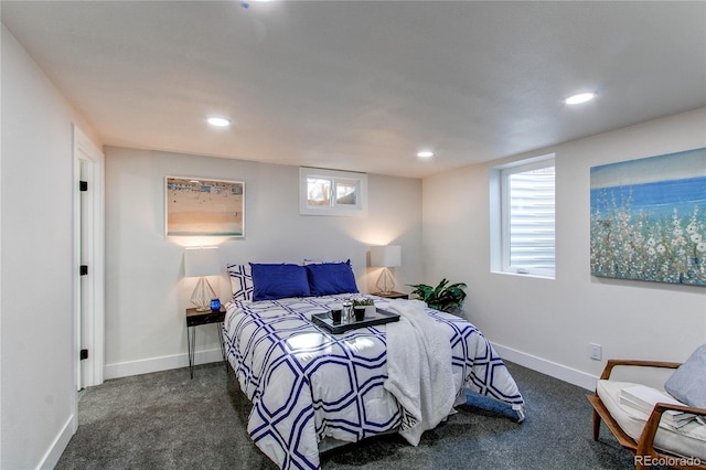 bedroom featuring dark colored carpet, recessed lighting, and baseboards