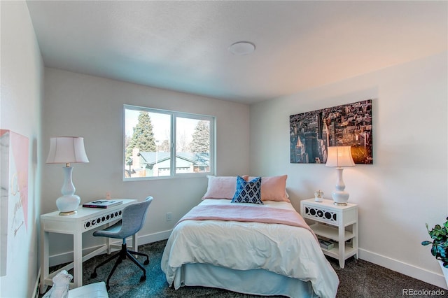 carpeted bedroom with baseboards