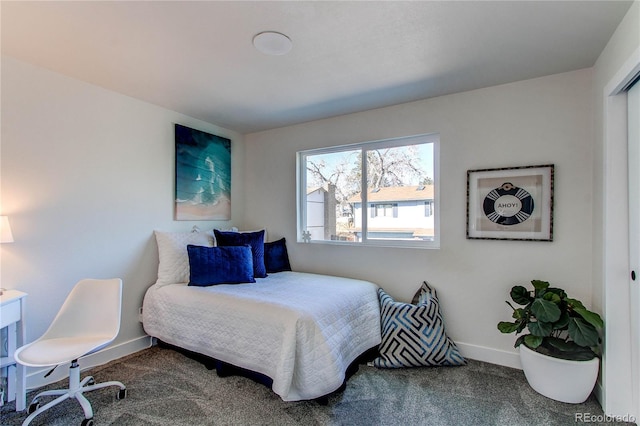 carpeted bedroom featuring baseboards