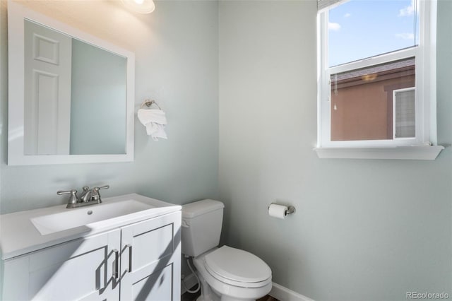 bathroom featuring toilet and vanity