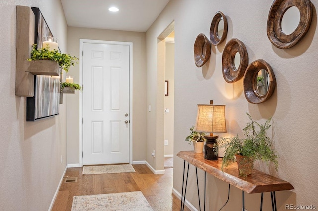 18067 E Anthem Dr, Parker, CO 80134 - entryway with wood finished floors, baseboards, and recessed lighting