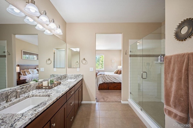 18067 E Anthem Dr, Parker, CO 80134 - full bathroom featuring connected bathroom, baseboards, double vanity, and tile patterned floors