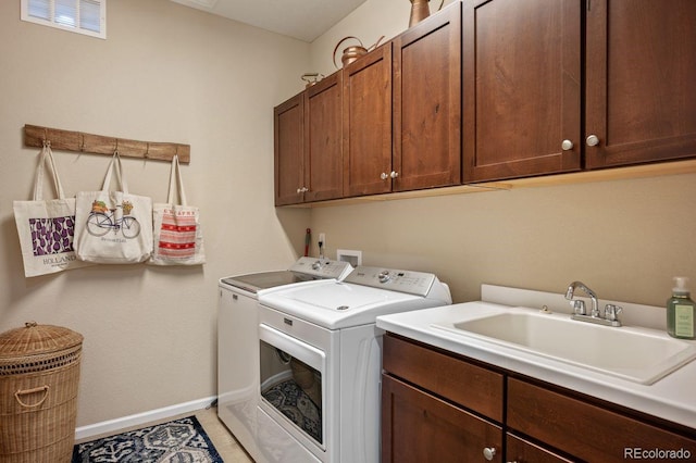 18067 E Anthem Dr, Parker, CO 80134 - laundry area featuring cabinet space, washing machine and dryer, and baseboards