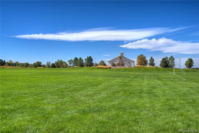 view of yard with a rural view