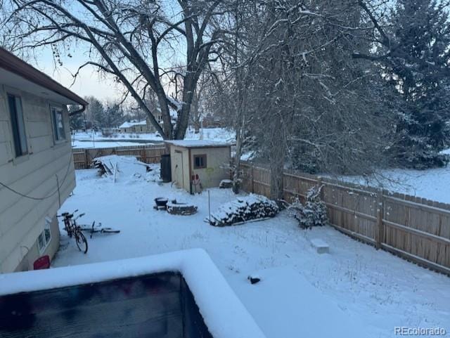 view of yard layered in snow