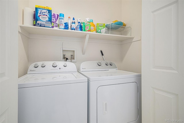 laundry room featuring washing machine and clothes dryer